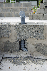 Image showing Wall-mounted sewer pipe for a washbasin in a partition