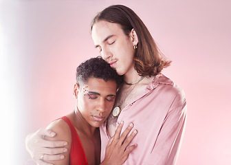 Image showing Gay, beauty and lgbtq people hug isolated on studio pink background in glow, pastel and creative art aesthetic. Fashion, diversity and love, queer transgender couple of friends in makeup or cosmetics