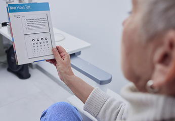 Image showing Senior woman, eye exam and vision for snellen test for nearsighted problem at optometrist consultation room. Elderly patient, healthcare or paper for eyes, reading or eyesight in retirement at clinic