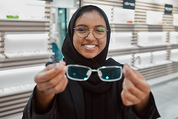 Image showing Optometry, portrait and Muslim woman with glasses for vision, help and shopping at a store. Working, retail and Islamic optician helping with eyewear fitting, consultation and eye care frame