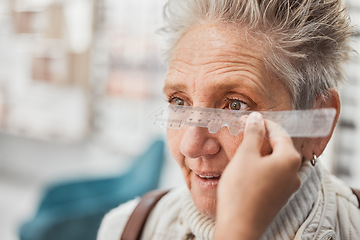 Image showing Optometry, ruler and doctor measuring eyes of a woman for glasses, frame fitting and eye distance. Healthcare, medical and mature patient with an optometrist to measure vision, lens and eyesight