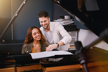 Image showing Musicians, piano and people writing music in a creative or recording studio with a song book. Art, creativity and couple in production of album or sound track together with a musical instrument.