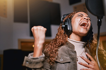 Image showing Music, singing and recording studio with a black woman celebrity at her record label to sing a song for her new album. Creative, art and performance with a female singer streaming live on the radio