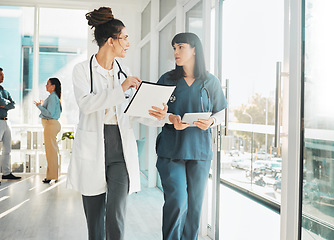 Image showing Advice, communication and doctors talking about healthcare, medical agenda and shift schedule. Medicine, training and speaking women in nursing planning a consultation with results at a hospital