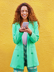 Image showing Phone, fashion and black woman isolated on wall background for social media, blog post or creative color ideas. Funky model or person typing on mobile app or smartphone for clothes creativity or tips