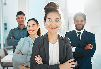 Image showing Portrait, collaboration and leadership with a manager woman and her team standing arms crossed in the office. Vision, teamwork or diversity and a female leader posing at work with her employee group