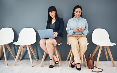 Image showing Waiting room, interview and women ready for hiring meeting with laptop and phone in office building. People, employee and worker preparing for business internship or job opportunity or employment