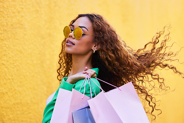 Image showing Wealth, posh and portrait of a woman with shopping bags for fashion, luxury sale and discount. Elegant, retail and rich girl in the city to shop, buying clothes and fashionable clothing on a wall