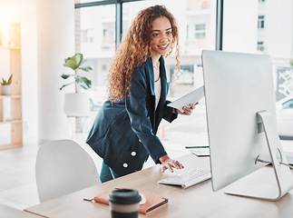 Image showing Businesswoman, computer and document in schedule tasks, planning or preparation strategy standing at office desk. Female employee manager checking desktop PC for project plan at the workplace