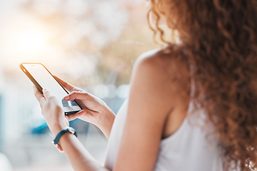 Image showing Hands, phone texting and black woman in city, summer sunshine and communication on web, app or chat. Smartphone, social network and girl with blurred background, reading and technology with email ux