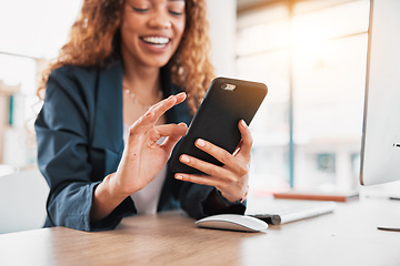 Image showing Phone, hand and communication with a business black woman laughing at a meme in her office at work. Contact, social media and mobile with a female employee browsing the internet for a joke or humor