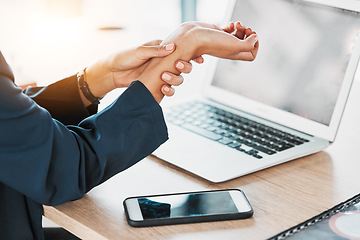 Image showing Business, closeup and woman with wrist pain, burnout and laptop in office, stress and deadline. Zoom, female employee and professional with smartphone, injury and muscle strain in workplace and hand