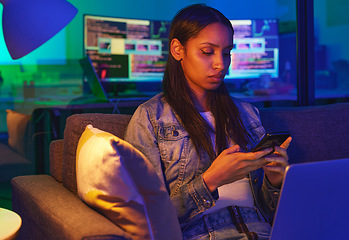 Image showing Phone, typing and sad woman in home on social media, texting or internet browsing in neon light. Night, technology and female programmer on sofa with mobile smartphone for networking or web scrolling