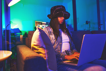 Image showing Programmer, hacker and woman typing on laptop in home at night in neon light to hack software. Cybersecurity, ransomware phishing and female coder coding on computer for hacking database with malware