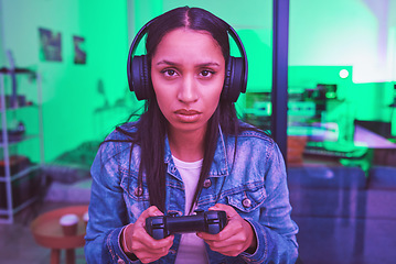 Image showing Headphones, portrait or gaming console in neon home with thinking, strategy or planning face expression in PC esports. Video gamer, woman or player in night house basement with cyberpunk technology