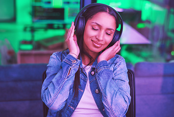 Image showing Music headphones, relax and woman in home streaming radio or podcast at night in green neon light. Hacker, it programmer and happy female coder listening and enjoying song, audio or sound in house.