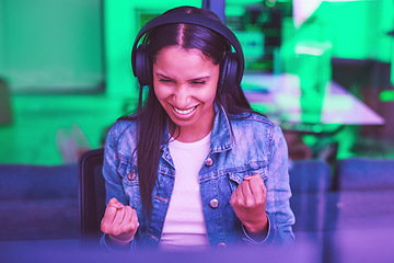 Image showing Headphones, success and celebration of hacker on computer after hacking software database. Night winner, neon light and happy woman, programmer and coder streaming music while celebrating winning.