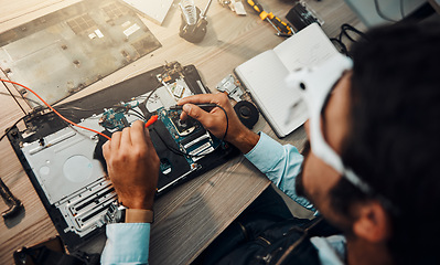 Image showing Hardware, engineering and IT professional repair motherboard, microcircuit or electronic device in a workshop or shop. Overhead, man and guy fixing a computer for technology in a lab or factory