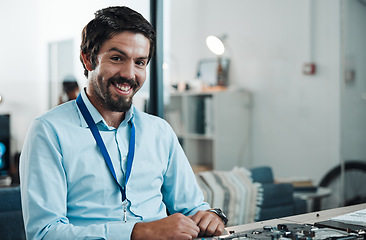 Image showing Happy, smile and portrait of a technician in his office planning repairs or maintenance for software. Engineering, professional and male employee working on an it development or project in workplace.