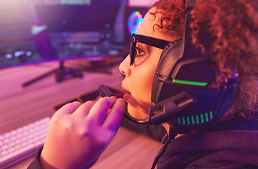 Image showing Video game, girl and talking on headphones in home for esports, online games and virtual competition. Female gamer, computer live streaming and gaming in neon lighting, technology and gen z streamer