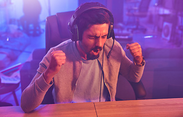 Image showing Winner, wow or man gamer success fist with microphone celebrating game win and motivation. Happy, cheering or esport player celebration for online competition, excited with progress and achievement