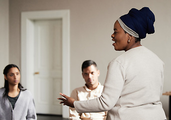 Image showing Talking, black woman and group of people in therapy with understanding, sharing feelings and psychology session. Mental health, addiction or depression, men and women with therapist sitting together.