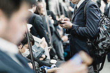 Image showing Business people traveling by Tokyo metro.