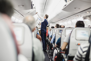 Image showing Steward on the airplane.