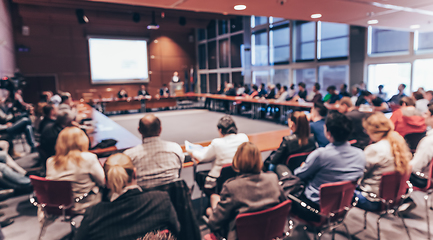 Image showing Public speaker giving talk at business event.