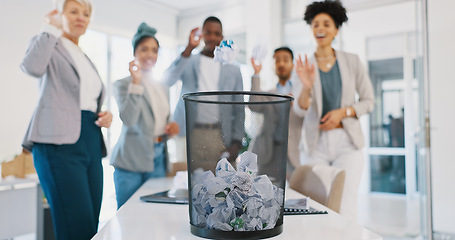 Image showing Office, trash and business people throw paper as a competition, game or challenge together. Happy, diversity and excited corporate team playing with with supplies in a bin for fun in the workplace.