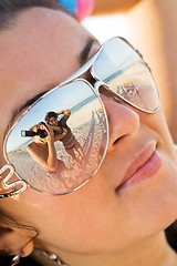 Image showing Reflexion of the photographer in model glasses