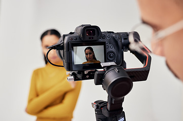 Image showing Photography, woman and photographer shoot fashion model in studio for creative, advertising and image. Media, backstage and professional man with girl and photoshoot, equipment and camera capture