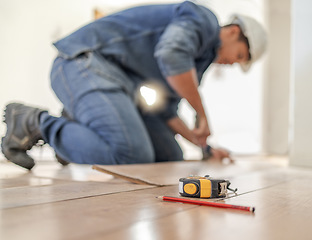 Image showing Construction worker tape measure, wood carpenter and home floor renovation of a builder. Working, woodwork and handcraft of a manufacturing, building and house maintenance development of an artisan