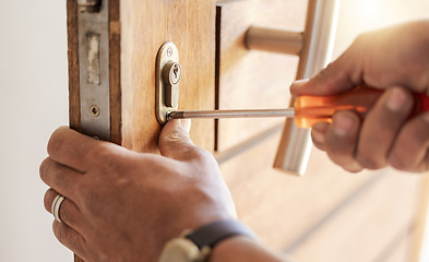 Image showing Locksmith hands, maintenance and handyman with tools, home renovation and fixing, change door locks and closeup. Construction, building industry and trade with manual labour, vocation and employee