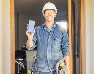 Image showing Construction worker, man in portrait and phone, screen with mockup and contact, digital marketing and handyman. Home renovation, maintenance and industry trade promo with product placement advert