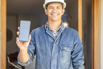 Image showing Construction worker, man in portrait and smartphone, screen with mockup and contact, digital marketing and handyman. Home renovation, maintenance and industry trade, promo with product placement