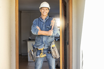 Image showing Handyman in portrait, maintenance and tools with construction and home renovation, builder with smile. Professional, contractor and DIY skills, architecture and wrench, male with helmet for safety