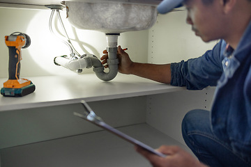 Image showing Plumber, sink maintenance check and plumbing data of a handyman in a kitchen. Water pipe installation, home repair checklist and builder in a household for building construction and inspection