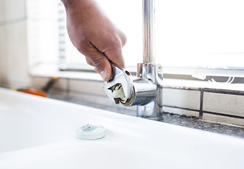 Image showing Faucet, wrench and plumber hand, plumbing and maintenance for kitchen sink, trade and manual labour. Person fixing tap, tools and home renovation with DIY, vocation skills and steel with service