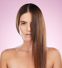 Image showing Hair, face and beauty and woman in portrait for haircare, skincare and keratin treatment on pink background. Cosmetics, grooming and hairstyle, dandruff free and makeup, female with healthy skin