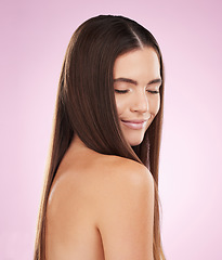 Image showing Hair, beauty and woman with haircare, face and skin glow with keratin treatment on pink background. Cosmetics shine, grooming and hairstyle, cosmetic care and female content with skincare and smile