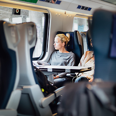 Image showing Lady traveling by train.