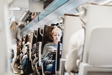 Image showing Lady traveling by train.