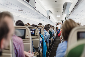 Image showing Interior of airplane with passengers on seats waiting to taik off.