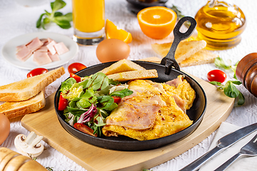 Image showing Omelet with ham and salad