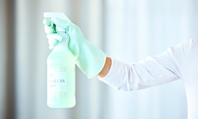 Image showing Bottle in hand, arm and spray for cleaning, cleaner and housekeeping with chemical, person with glove for safety. Housekeeper, disinfectant liquid to clean bacteria for hygiene and house work