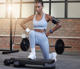 Image showing Fitness, exercise and a woman with music for lunges at gym for health and wellness training workout. Indian athlete person listening to earphones for motivation and inspiration to train strong body