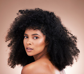 Image showing Hair, face and beauty with black woman in portrait, skin and natural cosmetics with glow on studio background. Female, cosmetic treatment with curly hairstyle, texture and growth with facial skincare