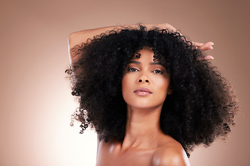 Image showing Beauty, hair and portrait of black woman in studio for self care with shampoo for growth. Aesthetic model with natural curly afro with cosmetics, skincare glow and face makeup on gradient background