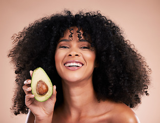 Image showing Black woman, studio portrait and avocado with smile, skincare and health with self care wellness by background. Happy gen z model, African and fruit for natural cosmetics, healthy nutrition or diet